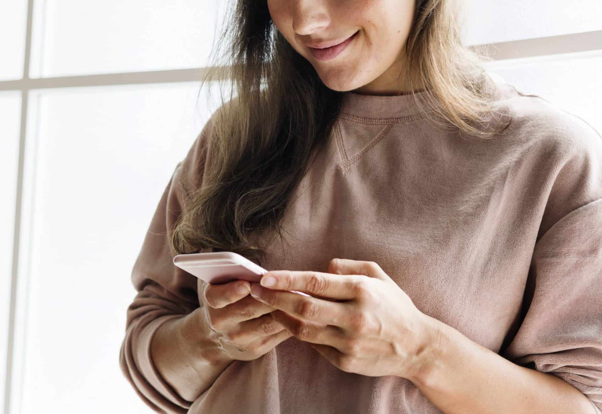 A Woman Using A Smartphone